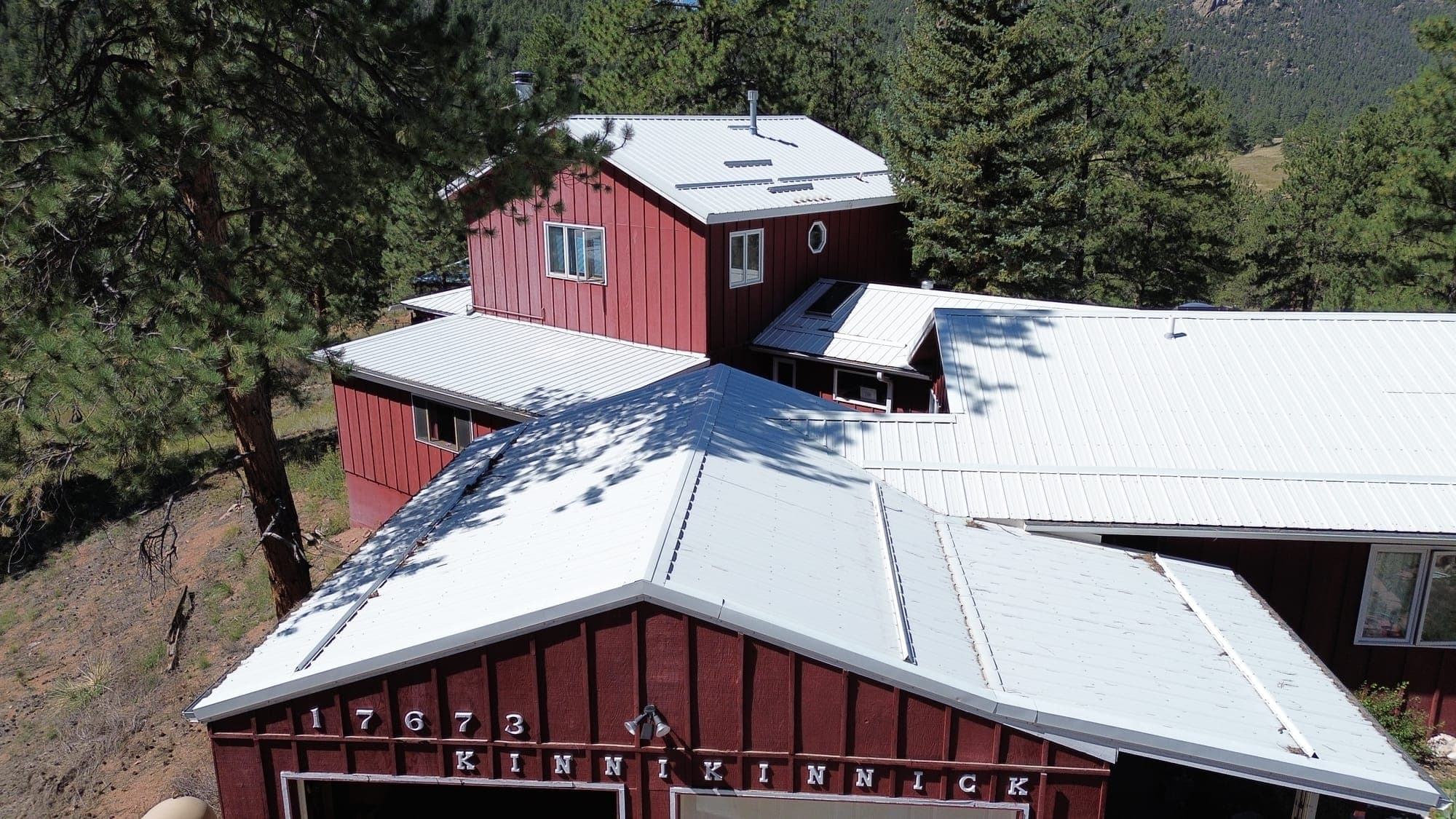 Completed standing-seam metal roof on a Colorado mountain home