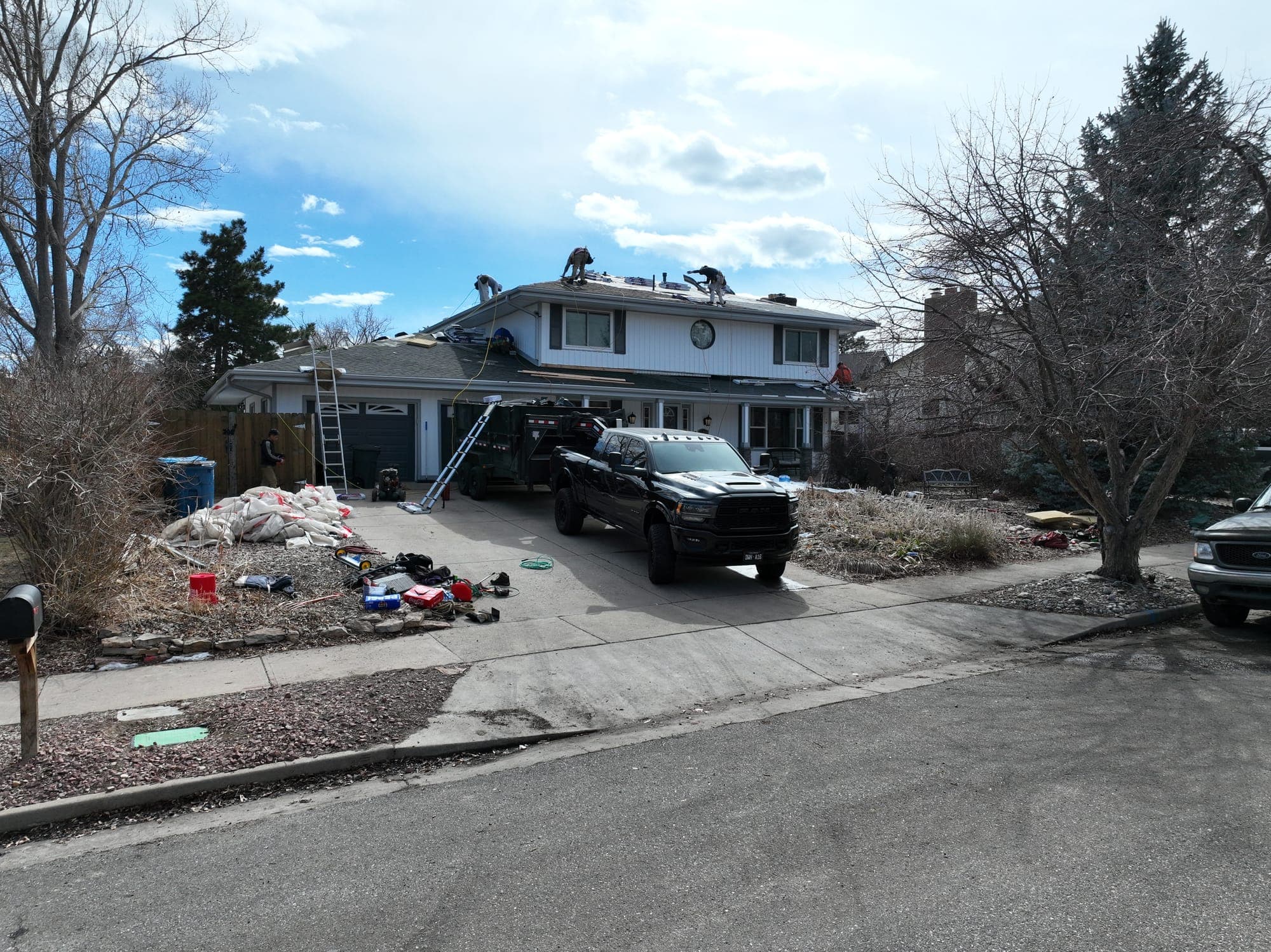 Upstream Roofers crew replacing a roof in Littleton, Colorado