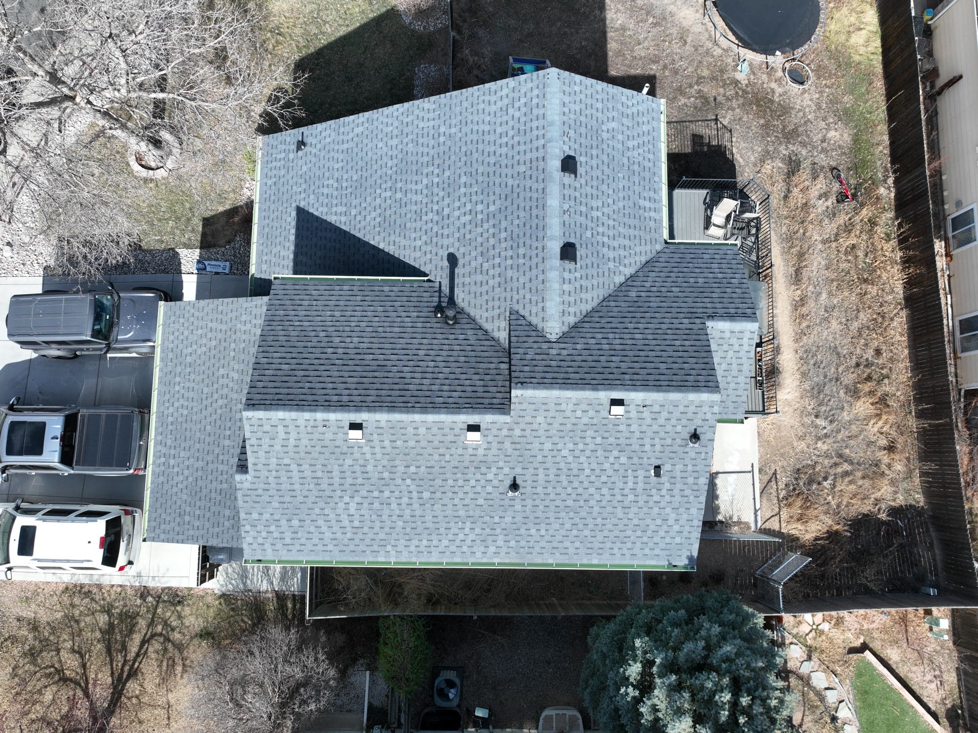 Completed charcoal architectural shingle roof, aerial view