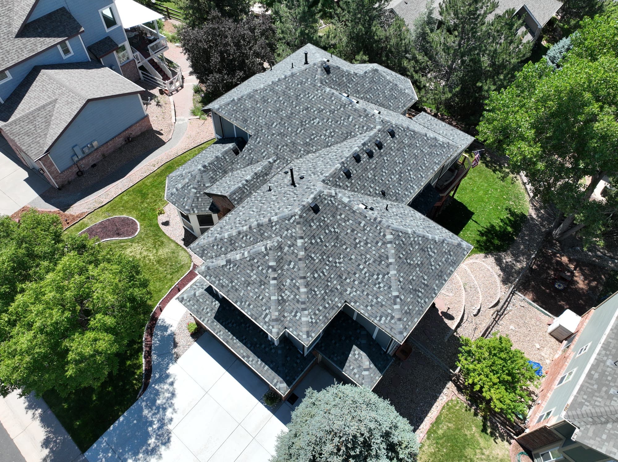New gray architectural shingle roof, top-down aerial view
