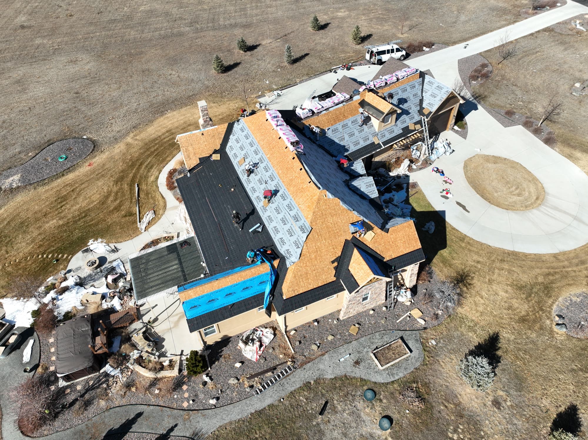 Large re-roof in progress, aerial view