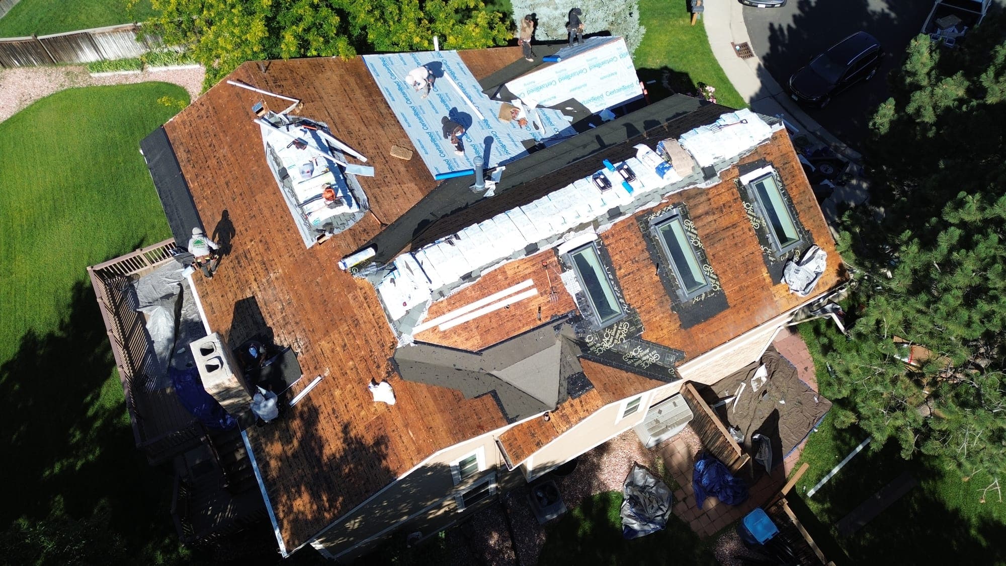 Roof replacement in progress on a Front Range home