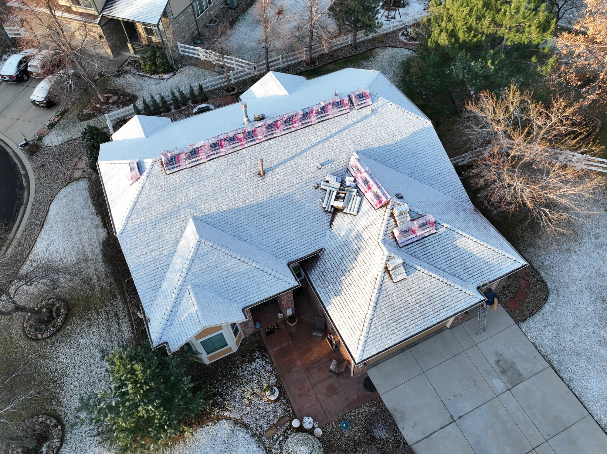 Roof installation in progress on a Westminster, Colorado home, aerial view